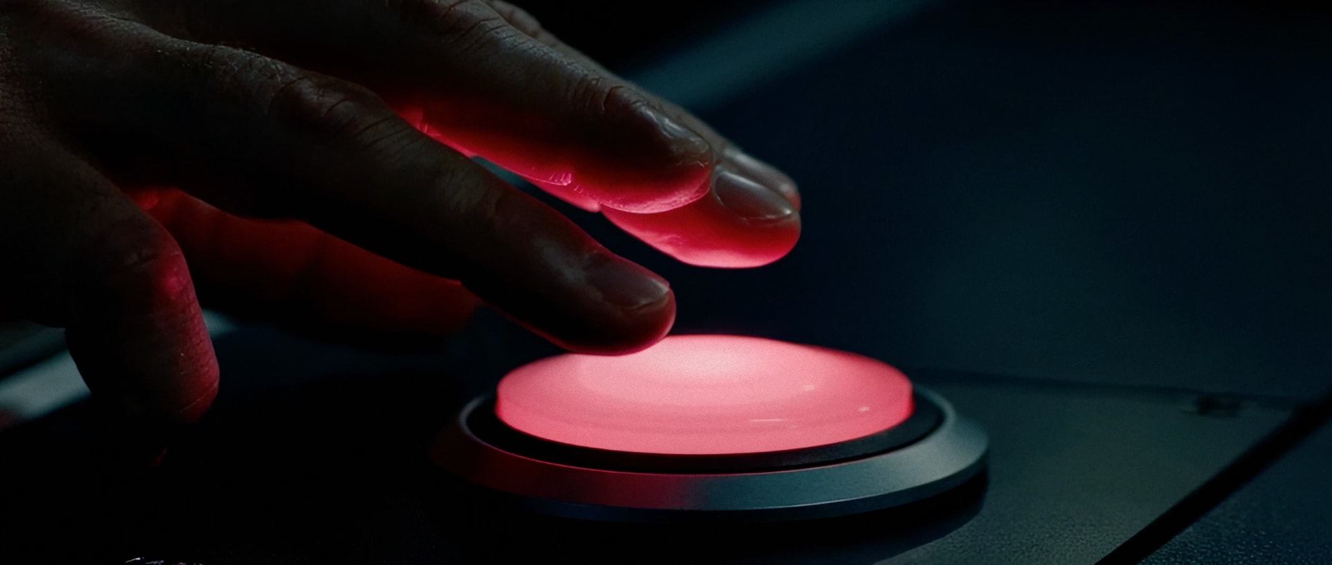The Tool — a hand reaching for a glowing red button